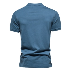 Men's slate blue short sleeve cotton Polo shirt featuring a classic ribbed cuff back view