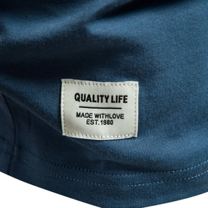 Men's navy cotton V-neck T-shirt detail showing fabric texture and Quality Life woven label