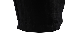 Close-up of black Lyocell cotton shorts hem showing high-quality stitching and fabric texture