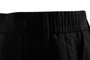 Detail of the elastic waistband and belt loop on black cotton twill business shorts