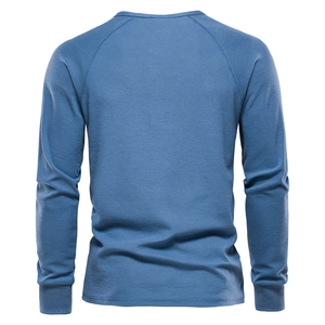 Men's blue waffle knit long sleeve Henley t-shirt with raglan sleeves and ribbed cuffs