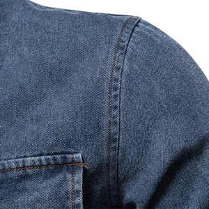Classic dark blue denim shirt featuring orange double-stitch seams and twill texture