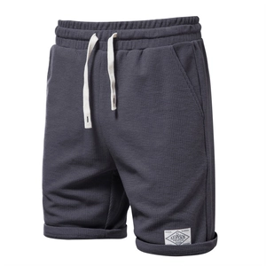 Men's dark grey waffle texture sports shorts with elastic waist and white drawstring