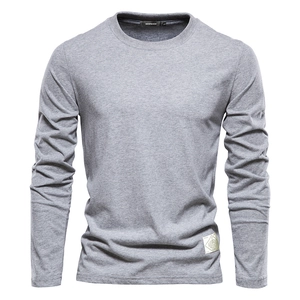 Men's solid light gray long sleeve cotton t-shirt with crew neck and premium brand patch