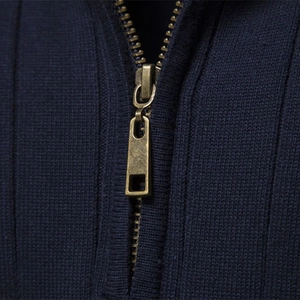 Men's navy blue half-zip sweater with detailed ribbed knit texture and bronze zipper