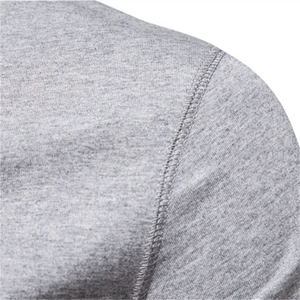 Close-up of grey Henley cotton T-shirt shoulder seam showing premium knitted fabric texture