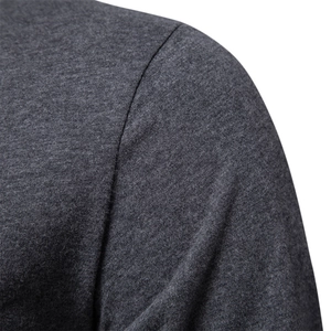 Close-up of shoulder seam on men's dark grey long-sleeve cotton T-shirt showing knit texture