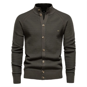 Men's dark olive green knit cardigan with waffle texture, stand collar and button front
