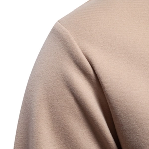 Close-up of shoulder stitching on a khaki crew neck sweatshirt for men in loose fit