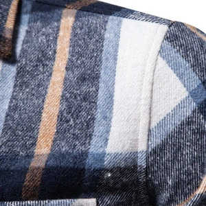 Close-up of thick plaid cotton flannel long-sleeve shirt with precise shoulder stitching