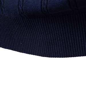 Men's dark blue V-neck cable knit vest with ribbed hem and high quality texture detail