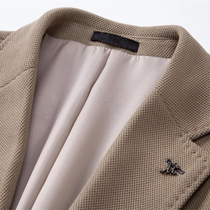 Slim fit brown men's casual blazer jacket with waffle texture and metal collar badge