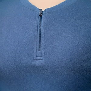 Blue men's half-zip fleece sweatshirt with stand collar and textured thermal fabric