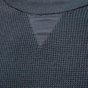 Men's dark grey crew neck waffle knit sweater with classic triangular V-insert detail