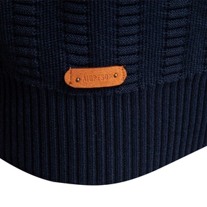 Men's dark blue striped knit sweater featuring textured cable knit and premium leather patch