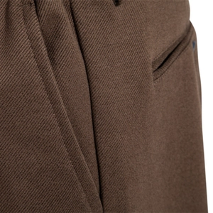Classic men's brown business trousers featuring thick twill fabric and pocket details