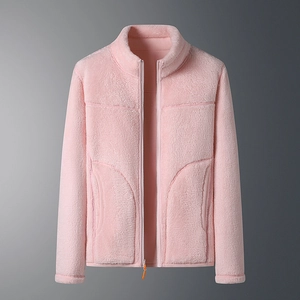 Close-up of soft pink reversible fleece jacket with stand collar and smooth zipper detail