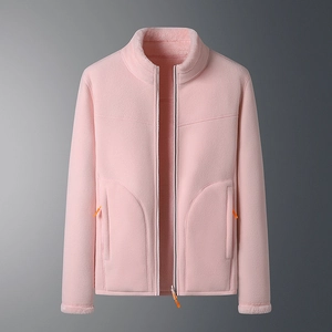 Detail of pink fleece jacket with warm lining and contrasting orange zipper puller