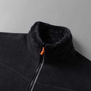 Detail of fleece jacket with stand-up collar, thick faux fur lining and orange zipper puller