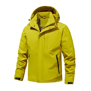 Detail view of yellow waterproof hooded jacket showing chest zipper and grid lining