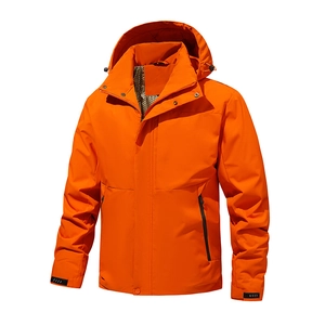 Detail of bright orange waterproof hooded outdoor jacket with windproof high collar
