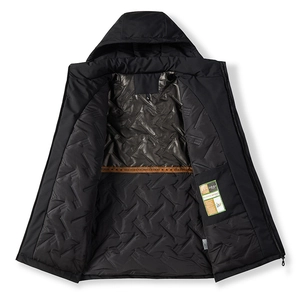 Detail of the quilted lining with inner pocket and size XL tag on a black winter jacket