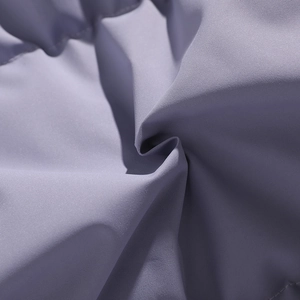 Macro view of light purple textured fabric showing the thick material and fine weaving
