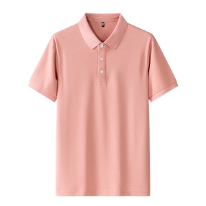 Close-up of coral pink polo shirt featuring pique texture and white resin buttons