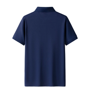 Detail view of navy blue polo shirt showing the breathable piqué cotton mesh texture