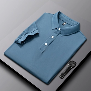 Detailed view of blue polo shirt with waffle texture fabric and three white buttons