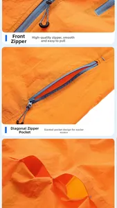 Dettaglio giacca solare arancione UPF50+ con tasche a zip e fodera interna in rete