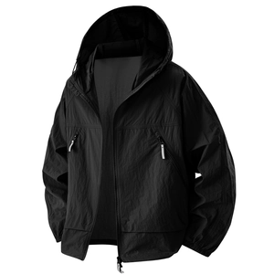 Detail view of men's black UPF100+ sun jacket with hood and zippered side pockets