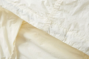 Detailed close-up of UPF100+ ice silk fabric with reinforced double stitching