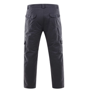 Detailed view of dark grey cargo pants with reinforced double stitching and side flap pockets