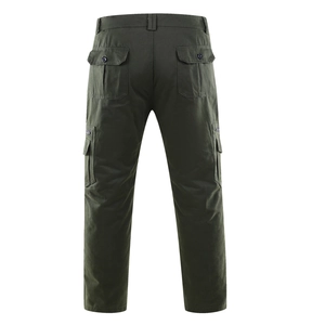 Rear view of dark green cargo pants featuring multiple flap pockets and durable cotton fabric