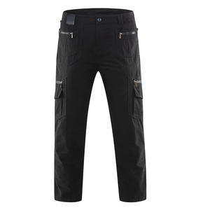 Men's loose tactical cargo pants in black cotton with multiple zip and flap pockets