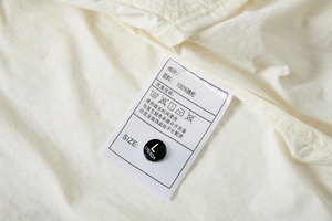 Detail view of the inner care label and 100% nylon cooling fabric on UV protection jacket