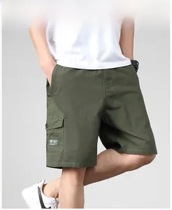 Detail shot of men's dark green cargo shorts showing the side flap pocket and patch