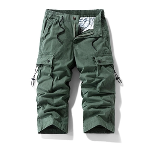 Men's loose fit cargo shorts in army green with multiple pockets and drawstring details