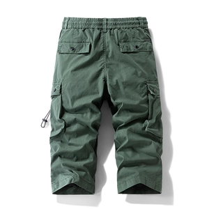 Detail of army green cargo pants featuring elastic waist and buttoned rear pockets