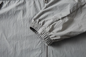 Detailed view of elastic cuffs and durable metal zipper on UPF100+ sun protection jacket