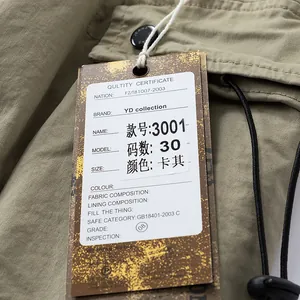 Close-up of khaki cargo pants detailing a branded paper hangtag with size and color data