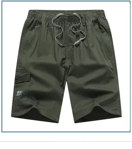 Detail view of cotton cargo shorts showing elastic waist, drawstring, and zip pockets