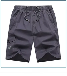 Detail of dark grey cargo shorts featuring elastic drawstring waist and side utility pocket