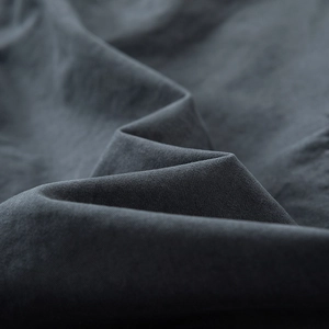 Macro shot of dark grey durable cotton blend fabric with fine texture for cargo pants