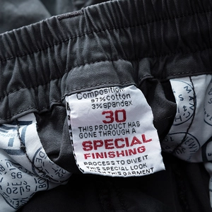 Detailed close-up of inner label showing 97% cotton material and special finishing