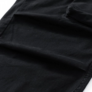 Close-up of fabric texture and reinforced stitching on cargo pants multi-pockets