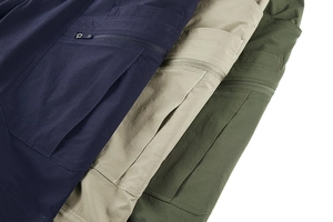 Detailed view of durable ripstop fabric and secure zipper pockets on tactical pants