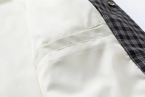 Close-up of internal lining and high-quality stitching on this plaid jacket
