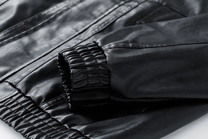 Detail of ribbed cuffs and fine stitching on a premium black leather jacket for men